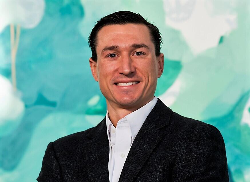 A photo of a man from the shoulders up. 