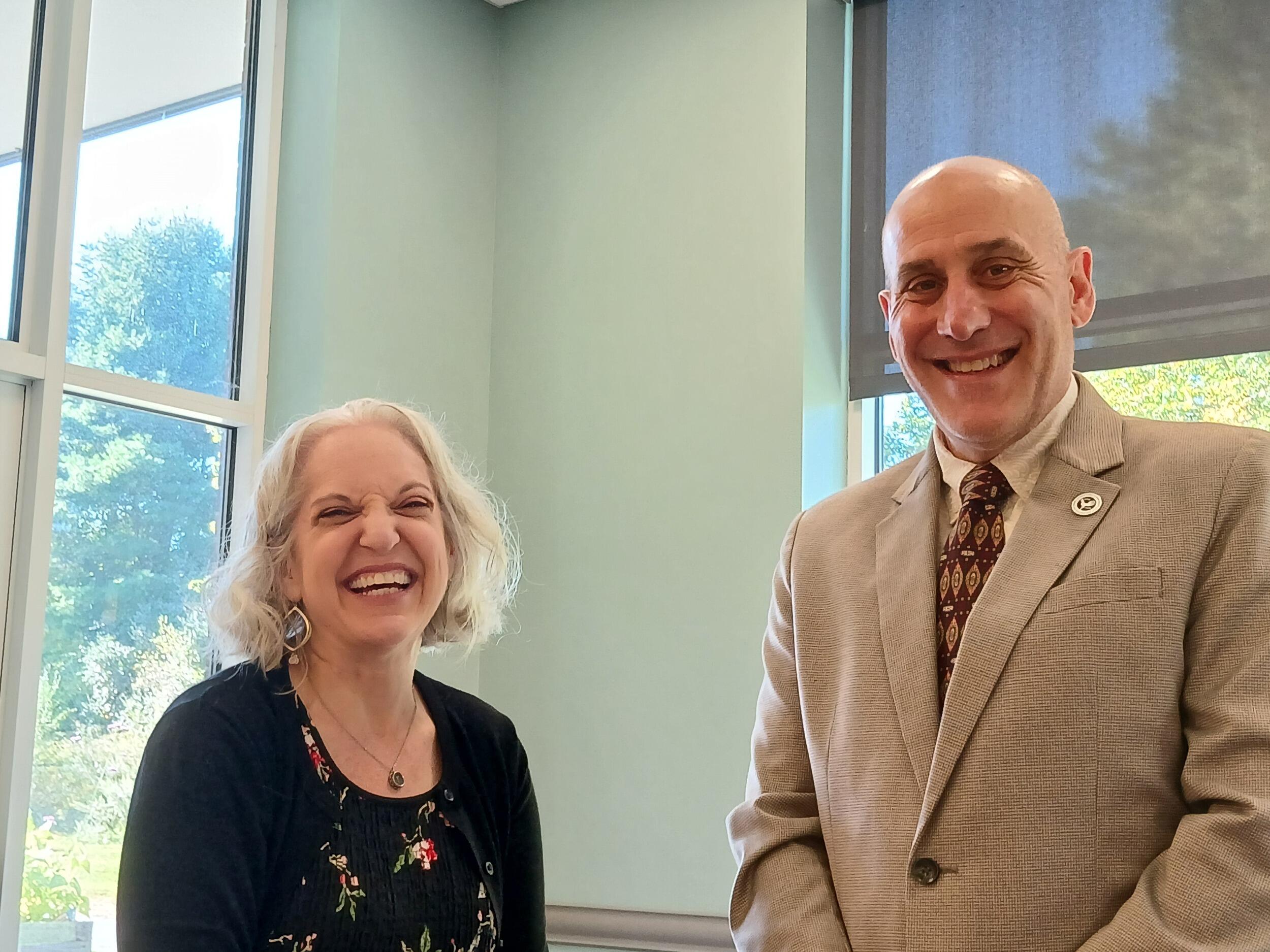A photo of a man and a woman smiling 