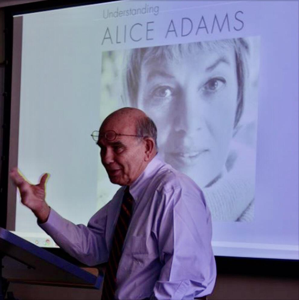 A man facing the left with his hand up in front of him 