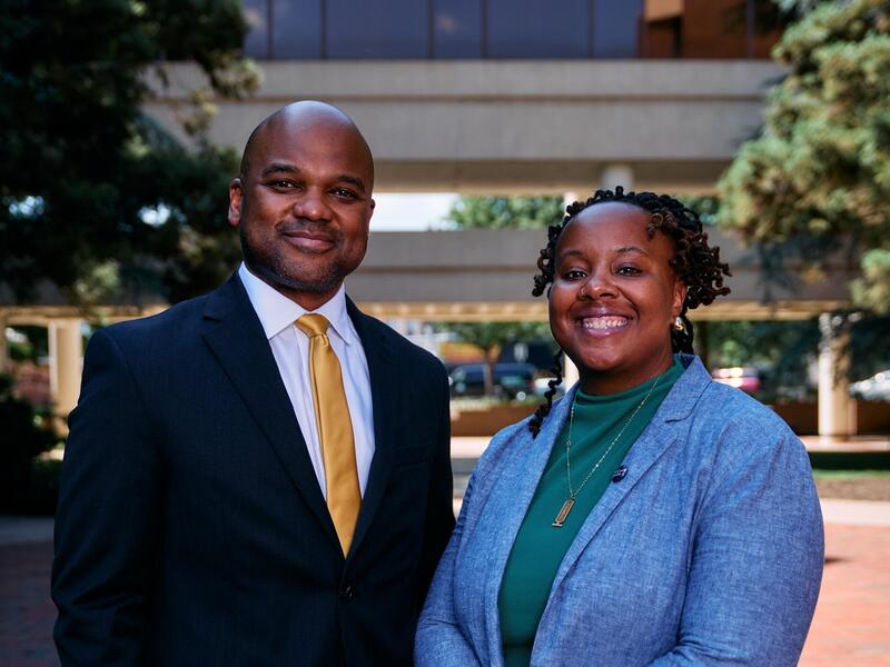 A photo of a man and a woman standing next to each other. 
