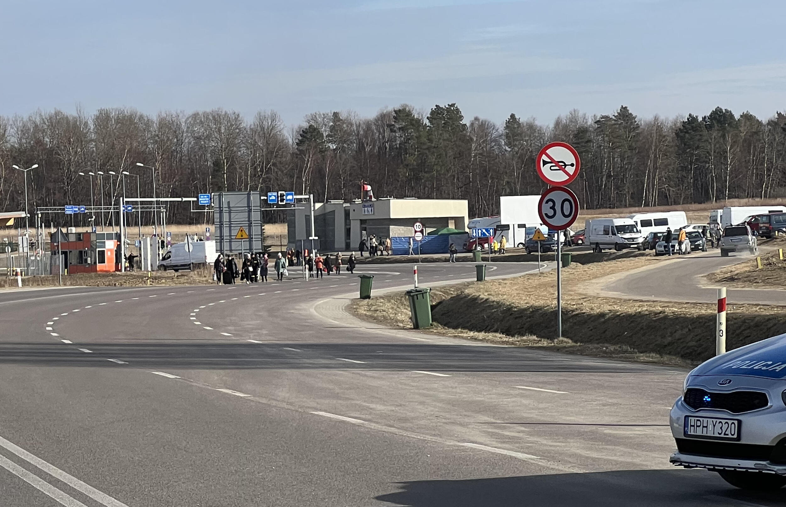 People walking across a road 