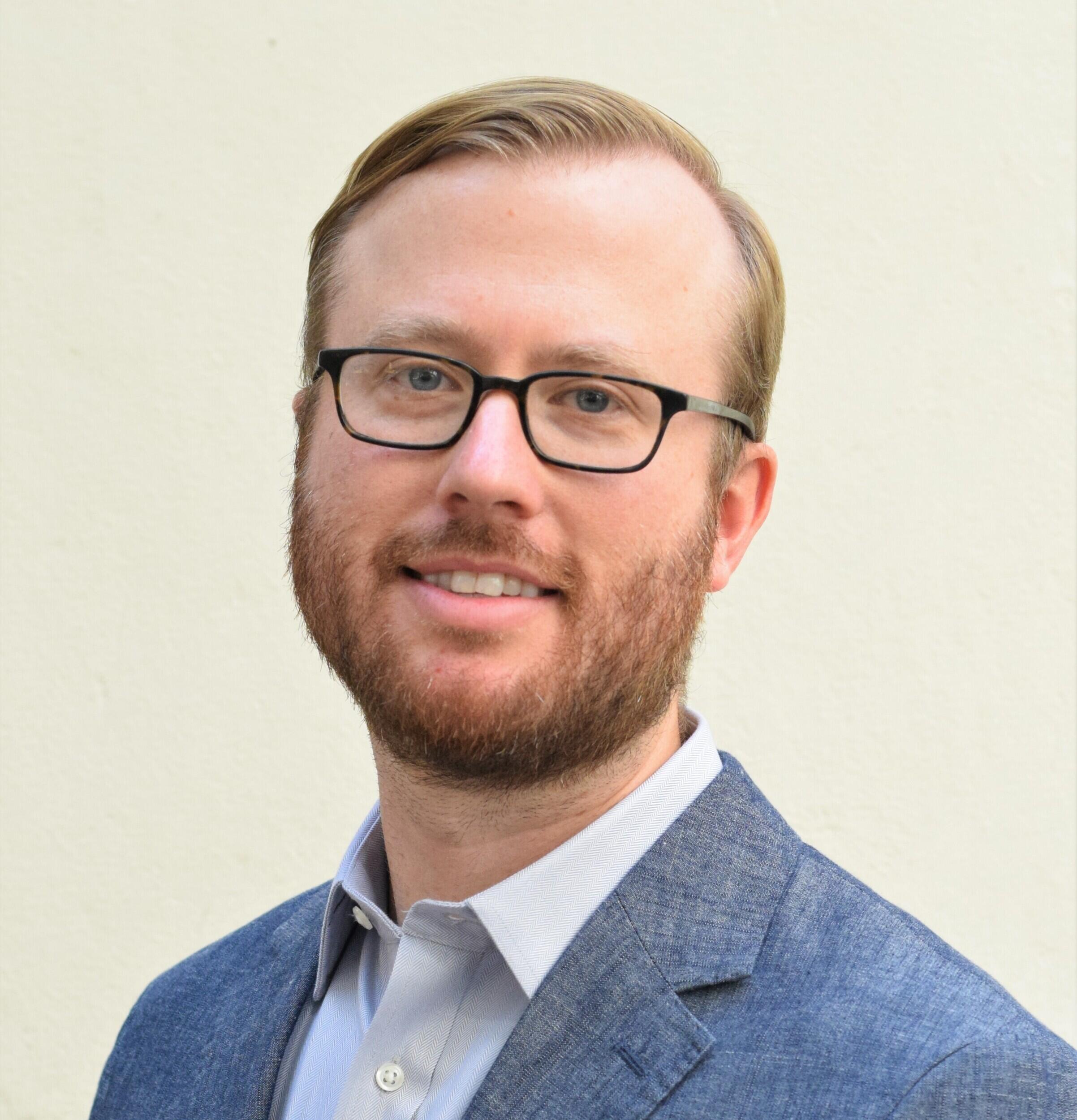 A portait of a man from the chest up