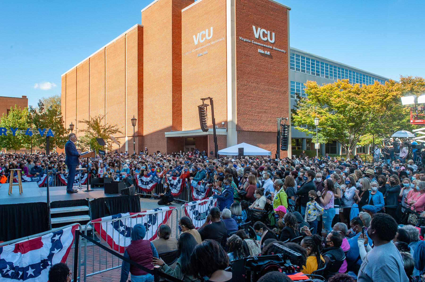 Terry McAuliffe standing on a stage at VCU in front of 2,000 people