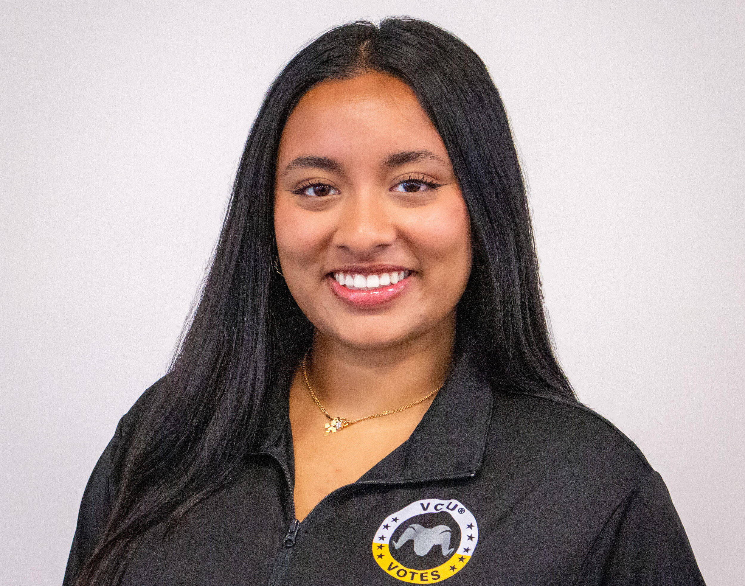 A photo of a woman from the shoulders up. 