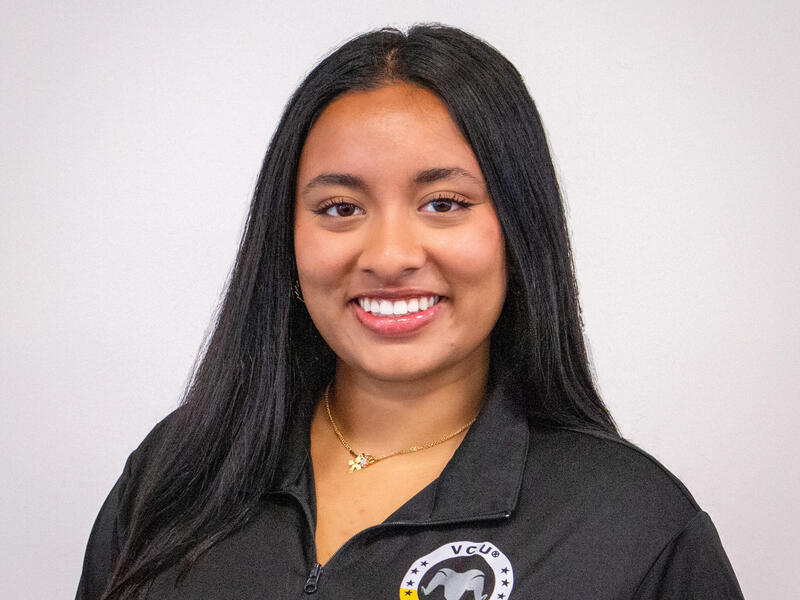 A photo of a woman from the shoulders up. 