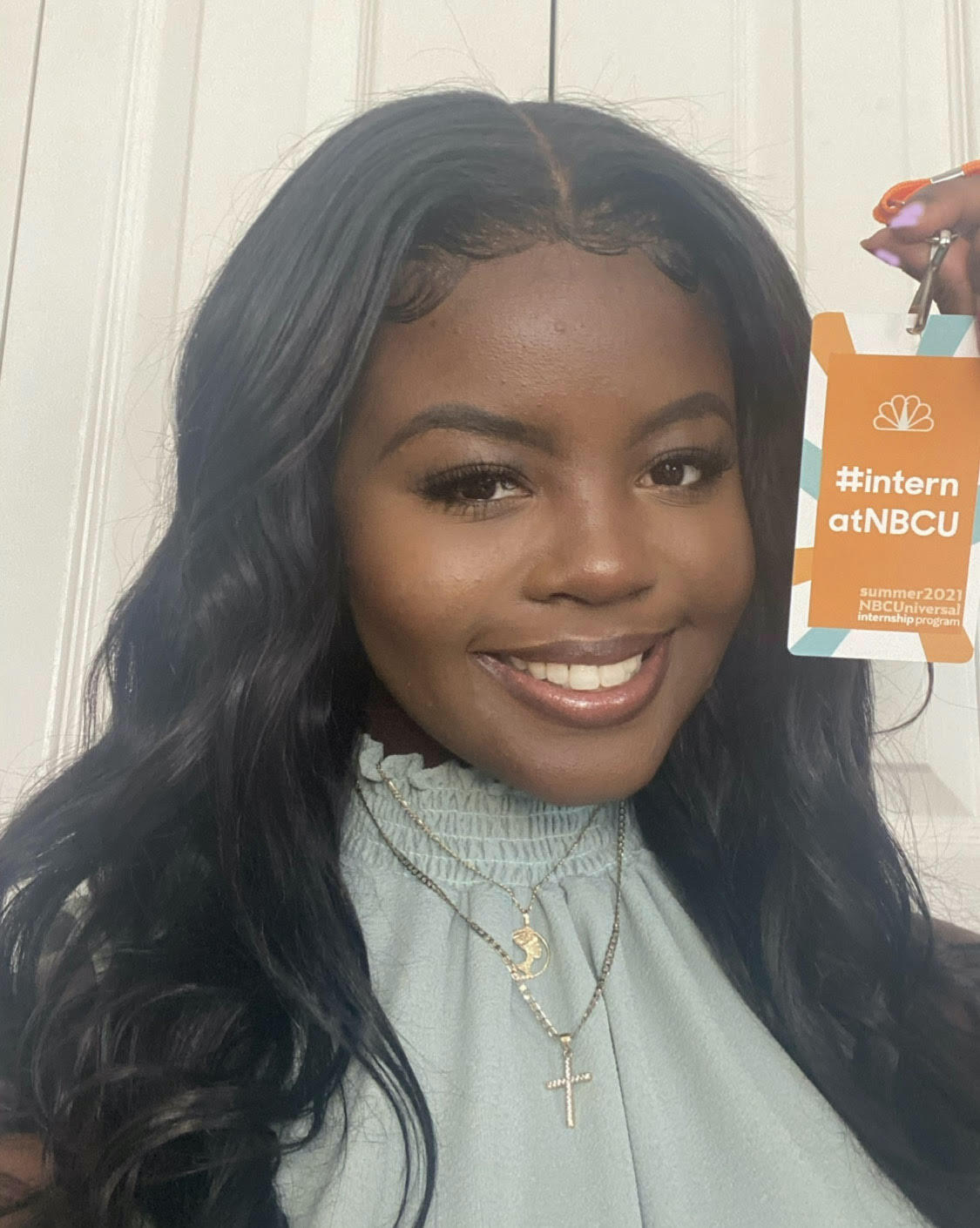 Josephine Walker holding her NBC badge.
