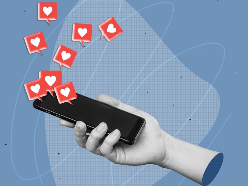 An illustration of a hand holding a smart phone