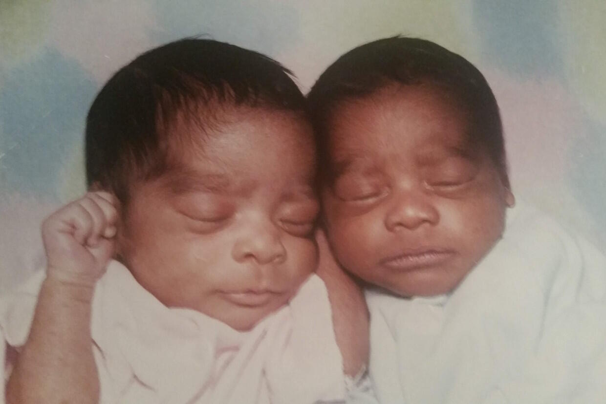 two babies next to each other