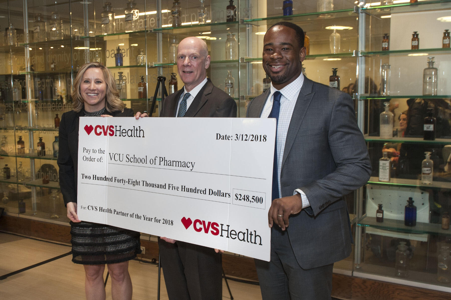 (From left to right) Amy Oliveira, senior director for pharmacy talent acquisition at CVS Health; Joseph T. DiPiro, Pharm.D., dean of the VCU School of Pharmacy; and Kelechi C. “K.C.” Ogbonna, Pharm.D., associate professor and associate dean of admissions and student services at VCU School of Pharmacy. (Photo credit: Kevin Morley)