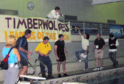 During a break from rehearsing, one of the film's stars, Julian Morris, (top railing) points a camcorder at Jeff Wadlow, director of "Living the Lie" while other cast and crew members prepare for a scene.