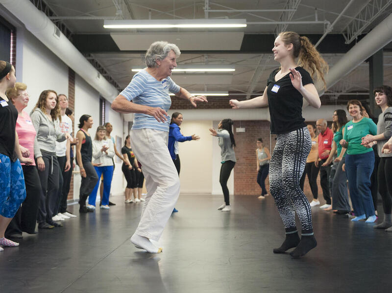 Dorothy Schoeneman, left, dances down the soul train line with Nicole Anderson