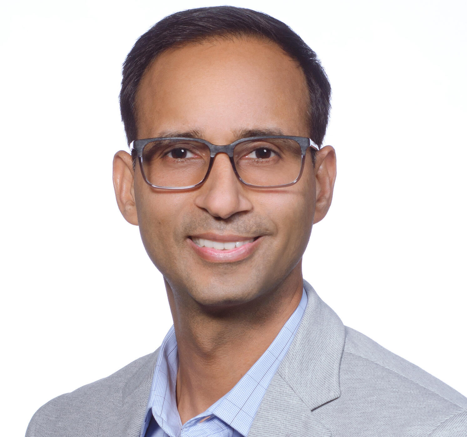 A photo of a man from the shoulders up. 