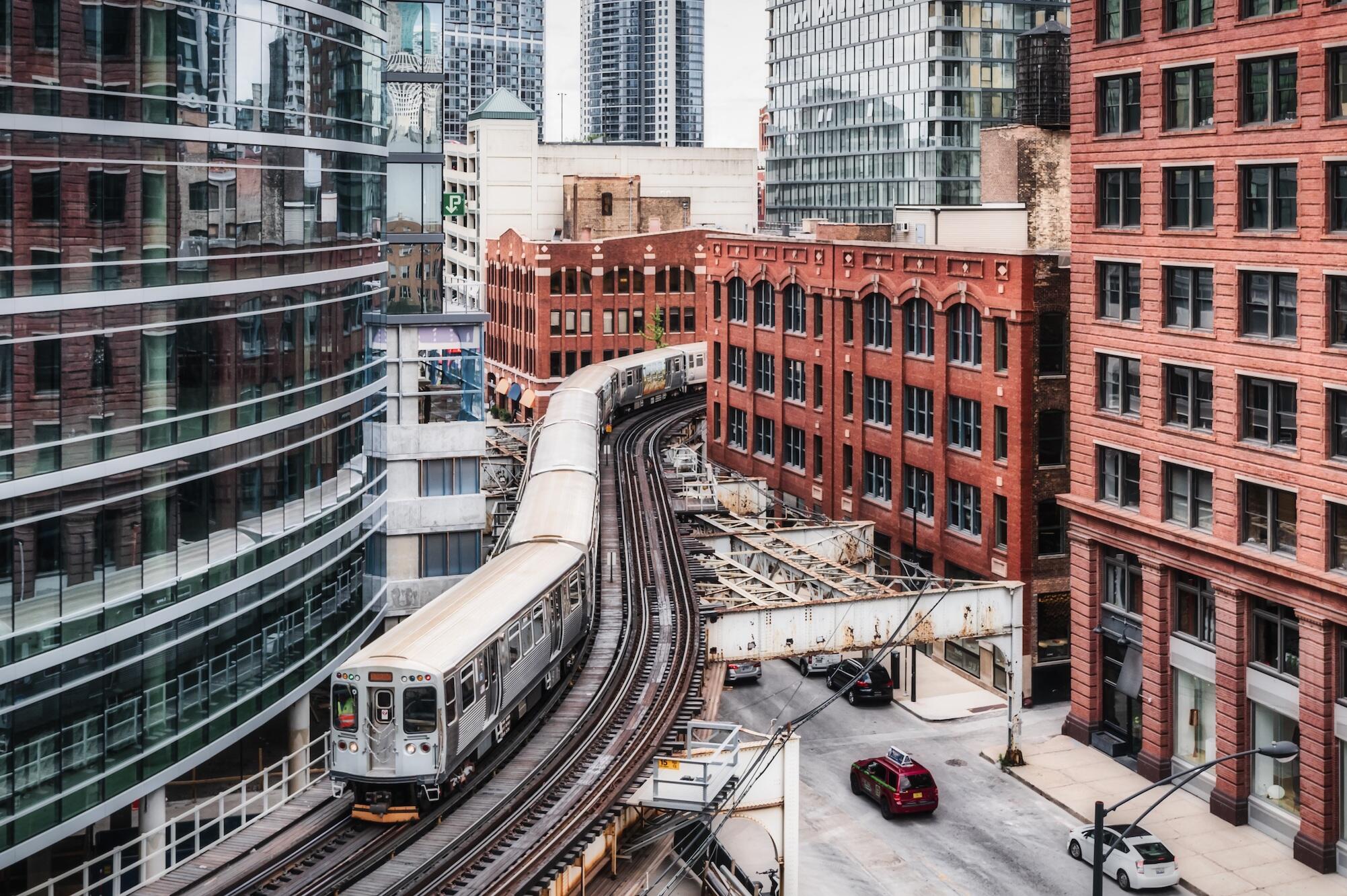 above-ground subway train snakes its way through the city