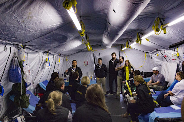 Allen Yee, M.D., gives instructions to the medical team at the start of a race day.