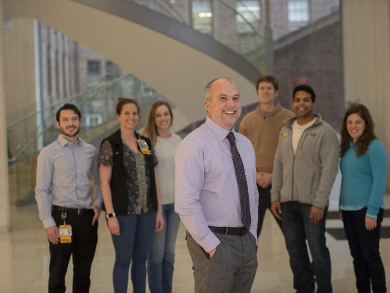 Chris Woleben standing in front of a group of students.