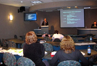Larry Williams, the founder and director of CARMA, introduces a speaker during a CARMA program.