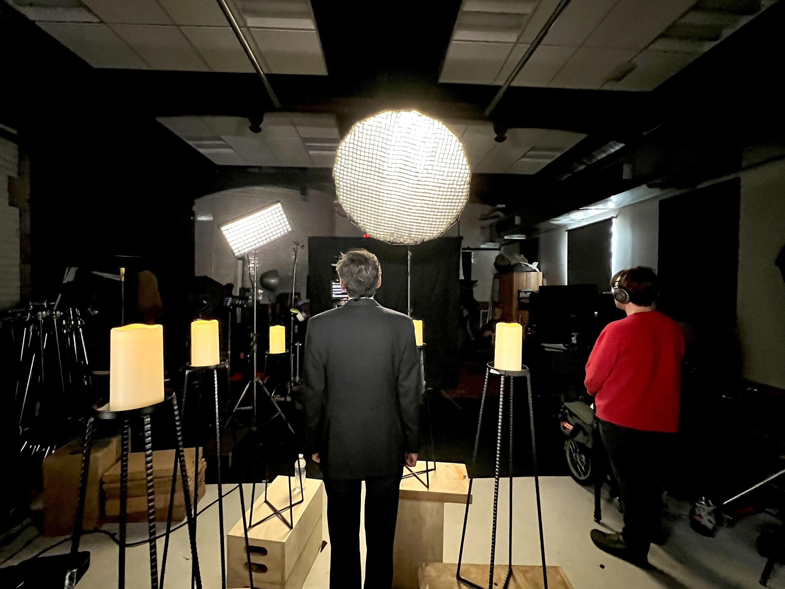 A view from behind of President Michael Rao on the set of the holiday video.