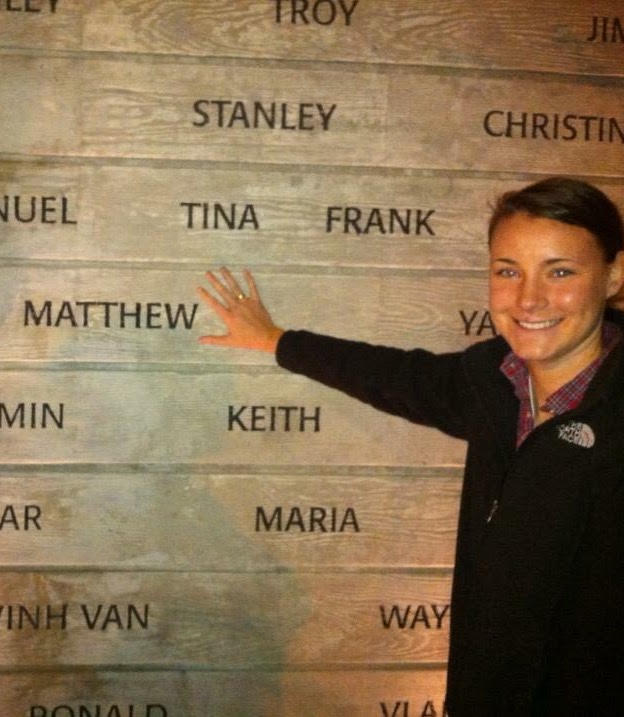 Heather Monger stands beside her brother's name at the National Donor Memorial at UNOS