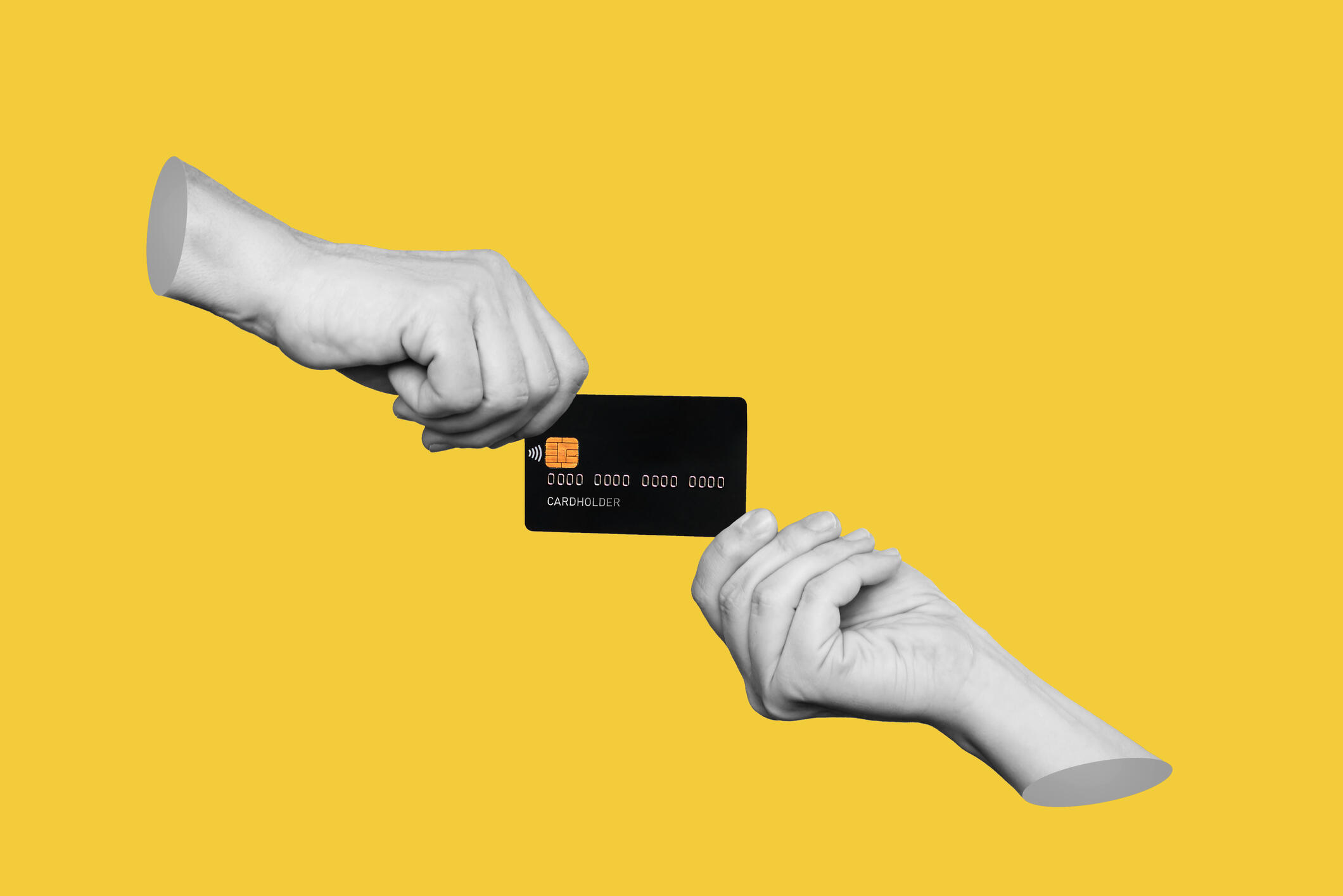 A hand hands a credit card to another hand.