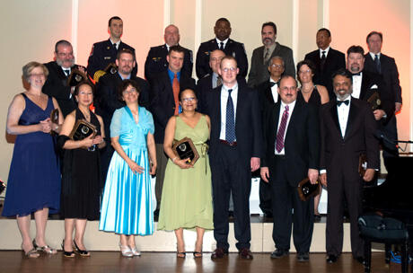 Front row from left: Lindy Creasey, dietician; Benedicta Casupanam, R.N., OR; Stephanie Hamilton, chaplain; Yolanda Guthrie, clinical social worker; William Christie III, patient; Wilhem Zuelzer, M.D., Orthopaedics; Ajai Malhotra, M.D., Trauma. Middle row from left: Robert Hawkins, RT; Greg Chenault, Pharm.D.; Charles Fields, M.D., chief resident; Tim Perkins, R.N., STICU; Rao Ivatury, M.D., trauma medical director; Tanya Huff, R.N., STICU; James McConnell, RT. Back Row from left: Chief Dennis Hales, paramedic, Chesterfield EMS; Capt. Mike Hite, paramedic, Chesterfield EMS; Capt. Vincent Urguhart, paramedic, Chesterfield EMS; Gareth Reeves, R.N., E.D.; Silas Shaw, ORT, OR; and Lynnwood Stallings, M.D., Anesthesia. 

Photo courtesy of VCU Trauma Program