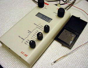 Prototype of Dr. Anthony Guiseppi-Elie's Implantable Lactate BioChip. A wire connects the implantable BioChip (lower right center) with a receiver that monitors levels of lactate in the body. A wireless version is being developed for the military.

Photo by Mike Frontiero, University News Services