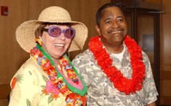 Dr. Phylllis Self, vice provost of Academic Technology, shows off her tropical attire with Dr. McDavis, who also sported a floral Hawaiian lei and blouse.