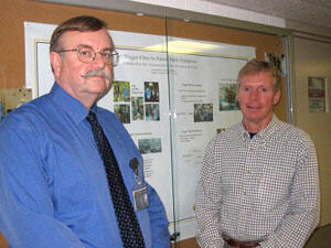 Dr. William Hartland, Jr., (left) and Dr. Chuck Biddle have promoted patient safety films as an effective tool for clinical training and faculty development at national seminars.

Photo by Michael Ford, University News Services