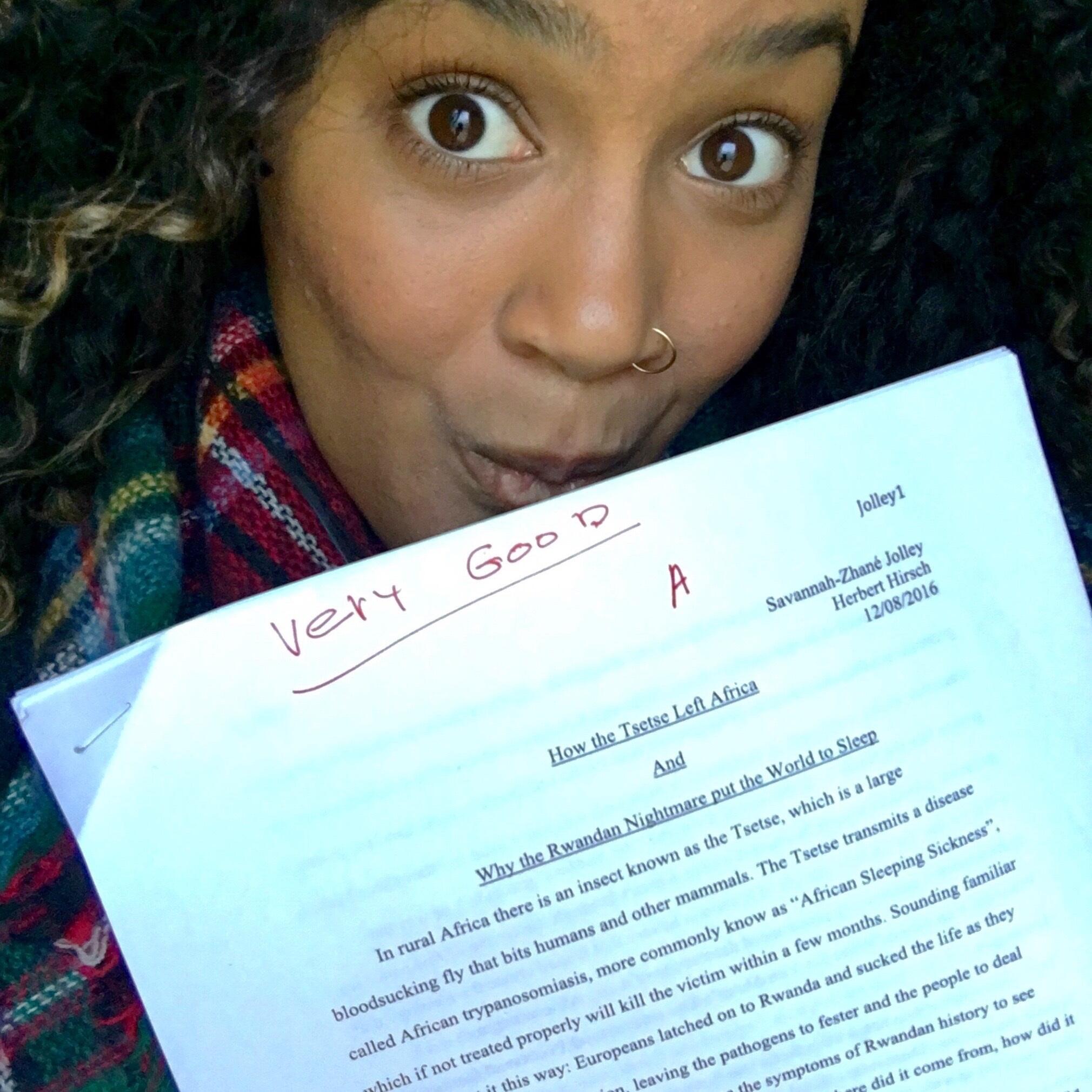 Jolley with her paper on the Rwandan genocide.