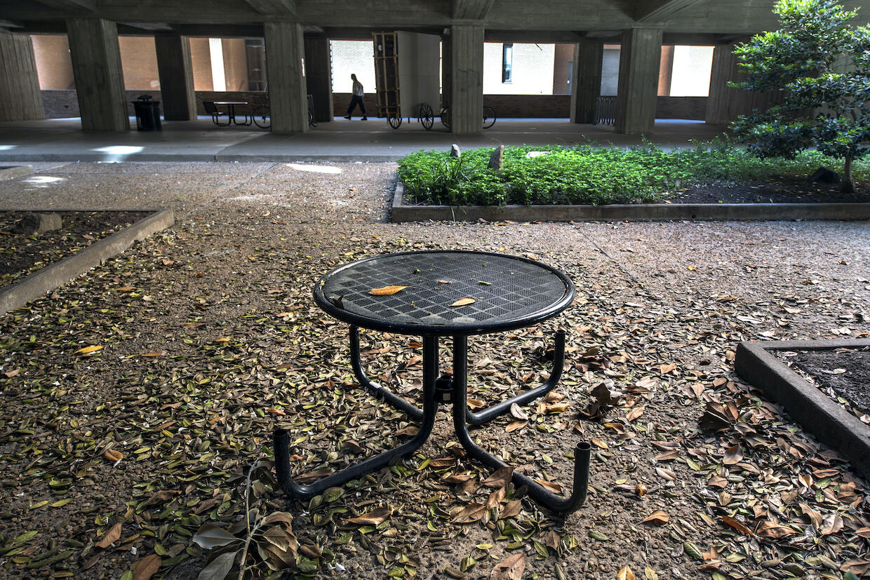 a metal table inside the pollak building courtyard at vcu