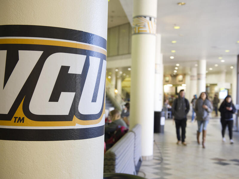 unidentified students walking through the VCU student commons