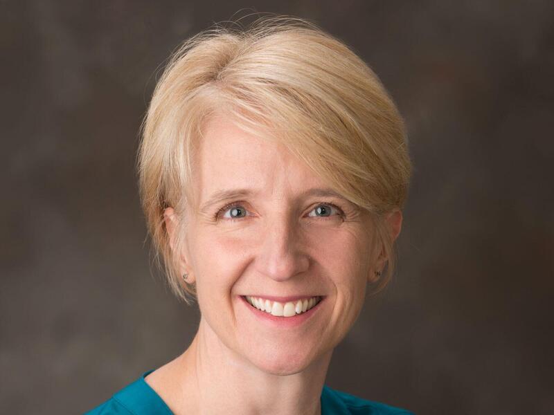 A smiling head shot portrait of Kathleen Rudasill