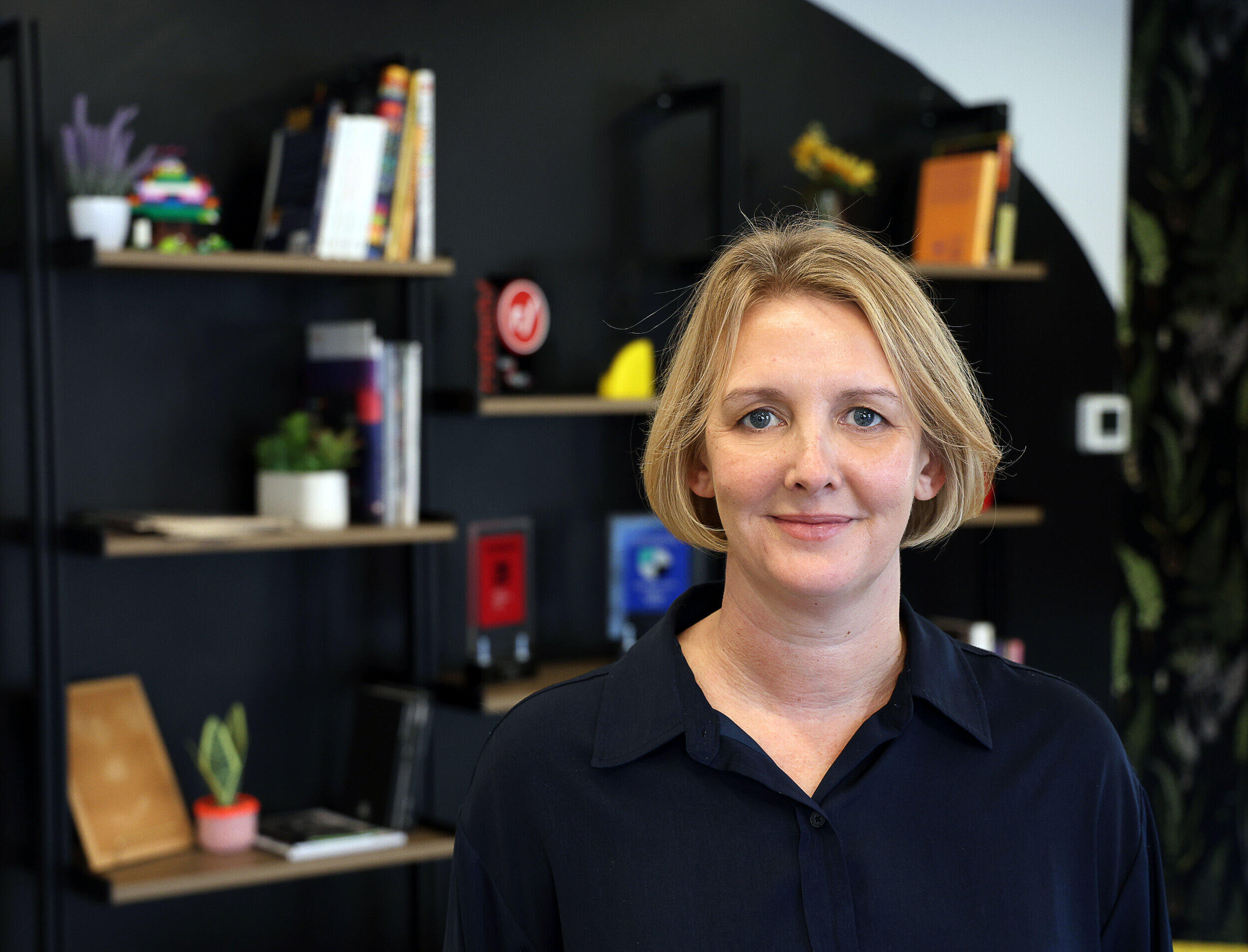 A photo of a woman from the shoulders up. 
