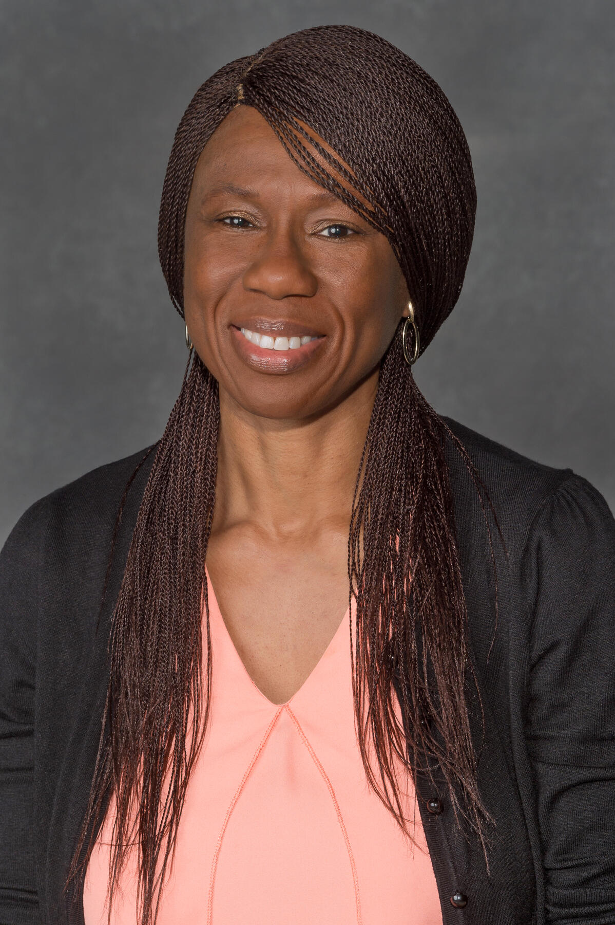 A portait of a woman from the chest up. 