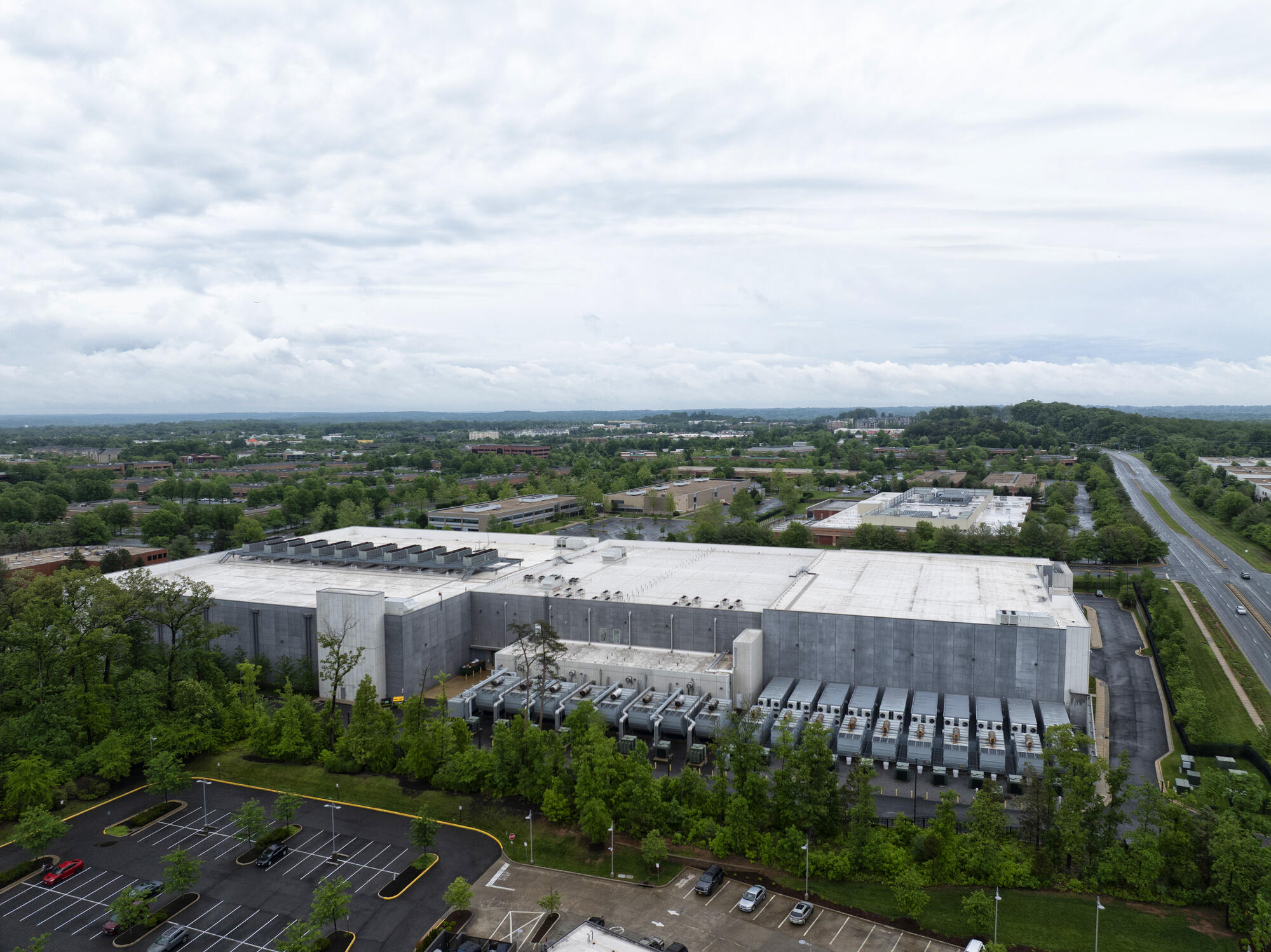 Aerial image of a large facility and a parking lot.
