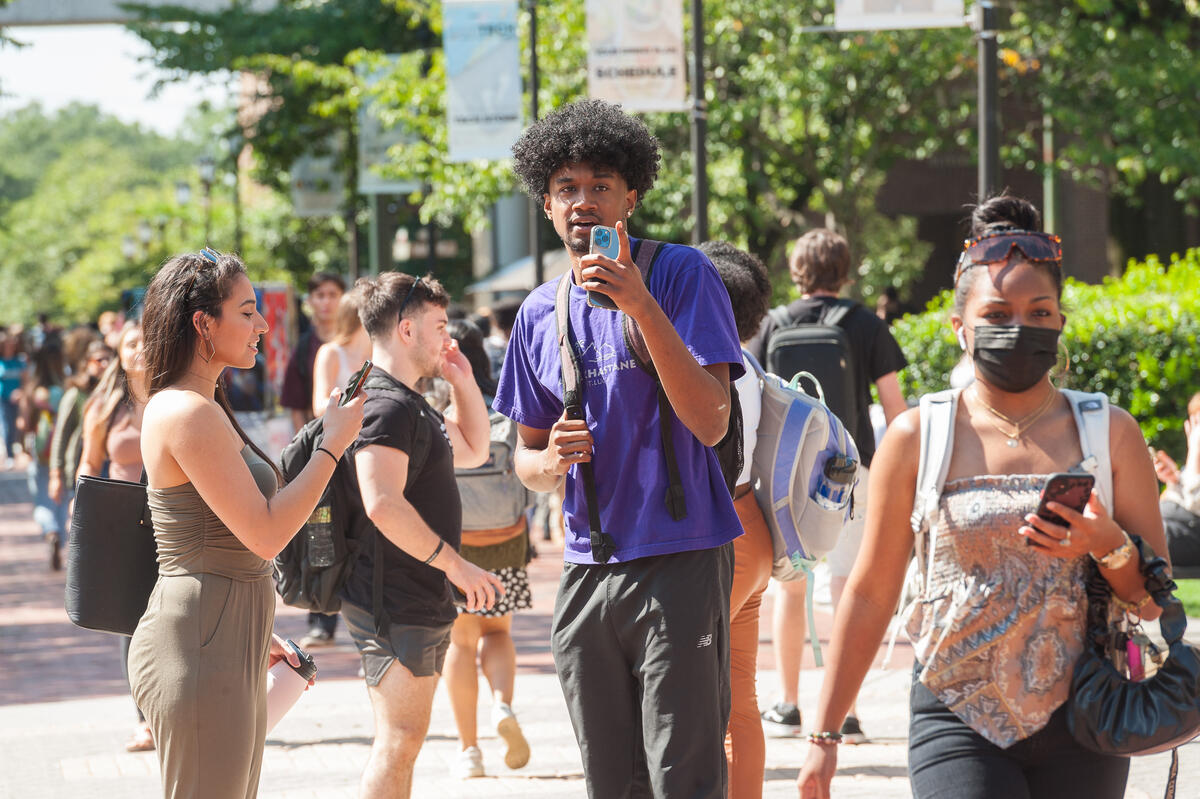 Students walking at the Student Commons plaza