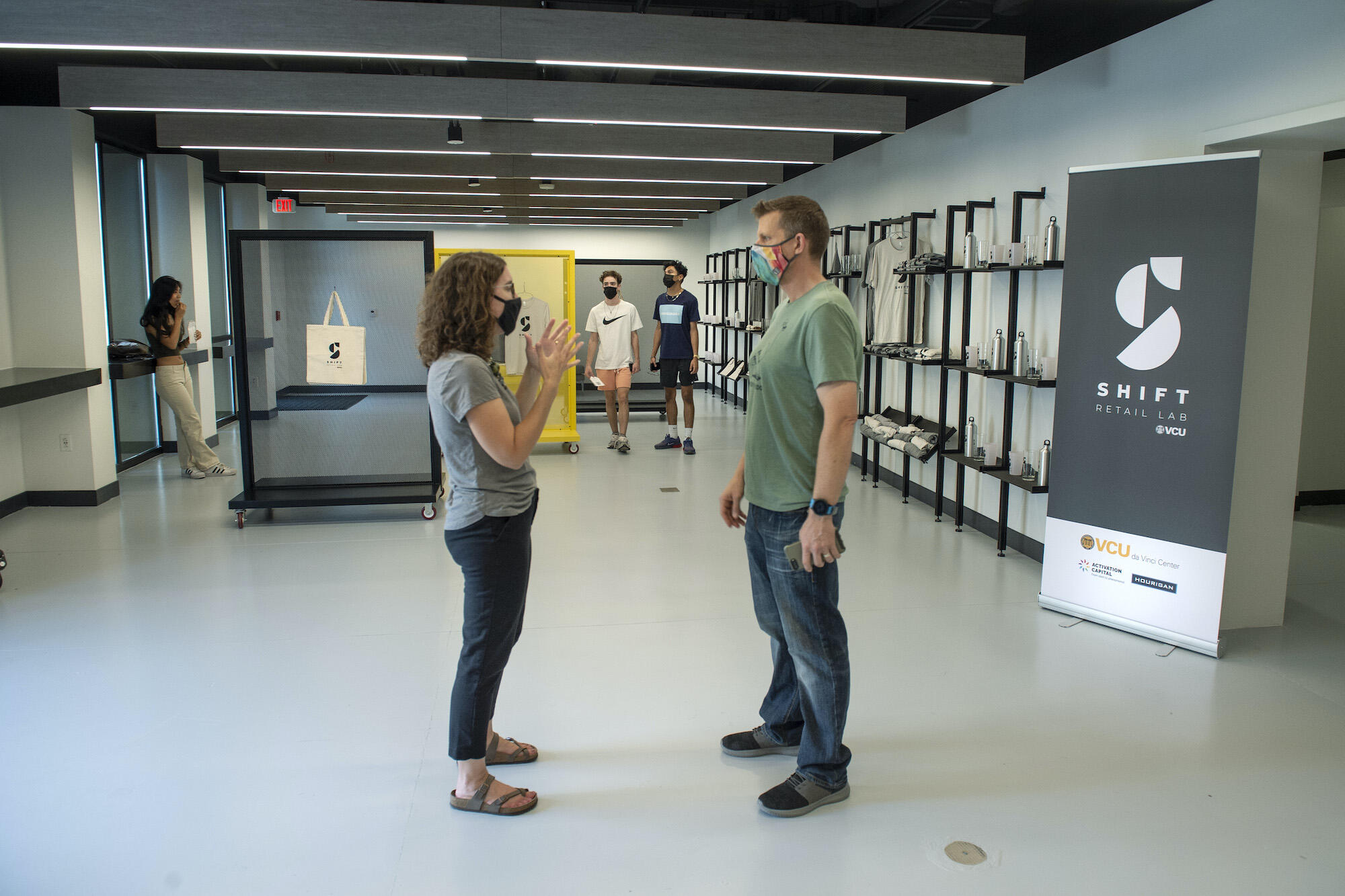 Mary-Chris Escobar, assistant director for academic programs at the DaVinci Center, talks with Jay Markiewicz, Ph.D., assistant professor and executive director of entrepreneurship programs.