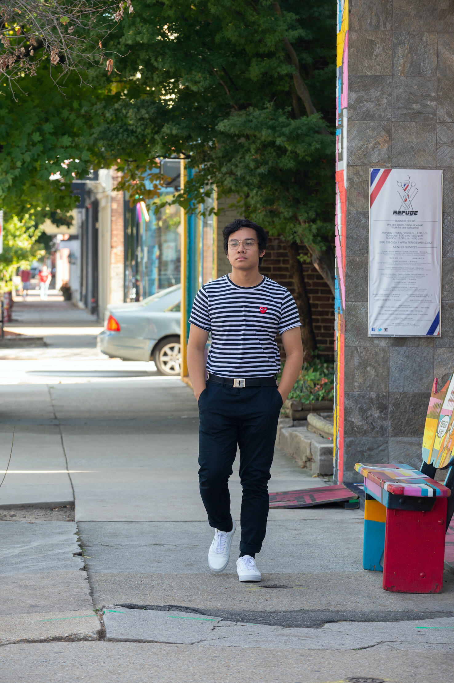 Jon Mirador walking down a sidewalk in Richmond.
