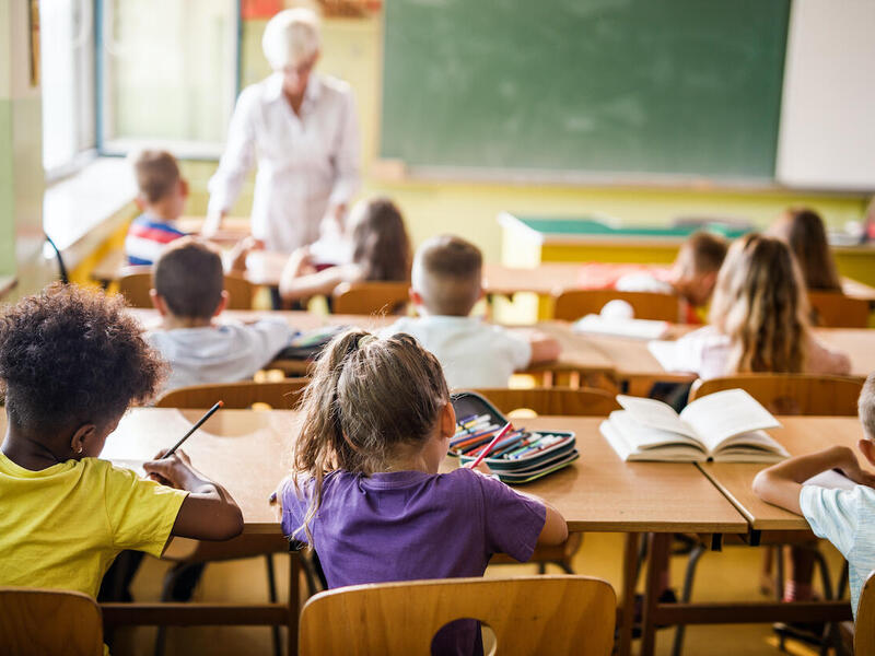 A classroom with students and an instructor.