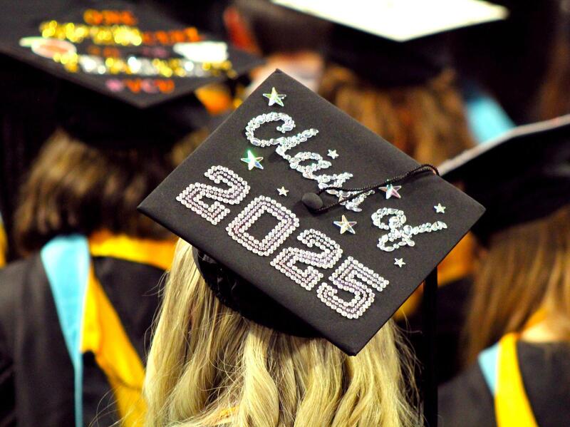 Top of a mortarboard being worn by a graduate that reads Class of 2025.
