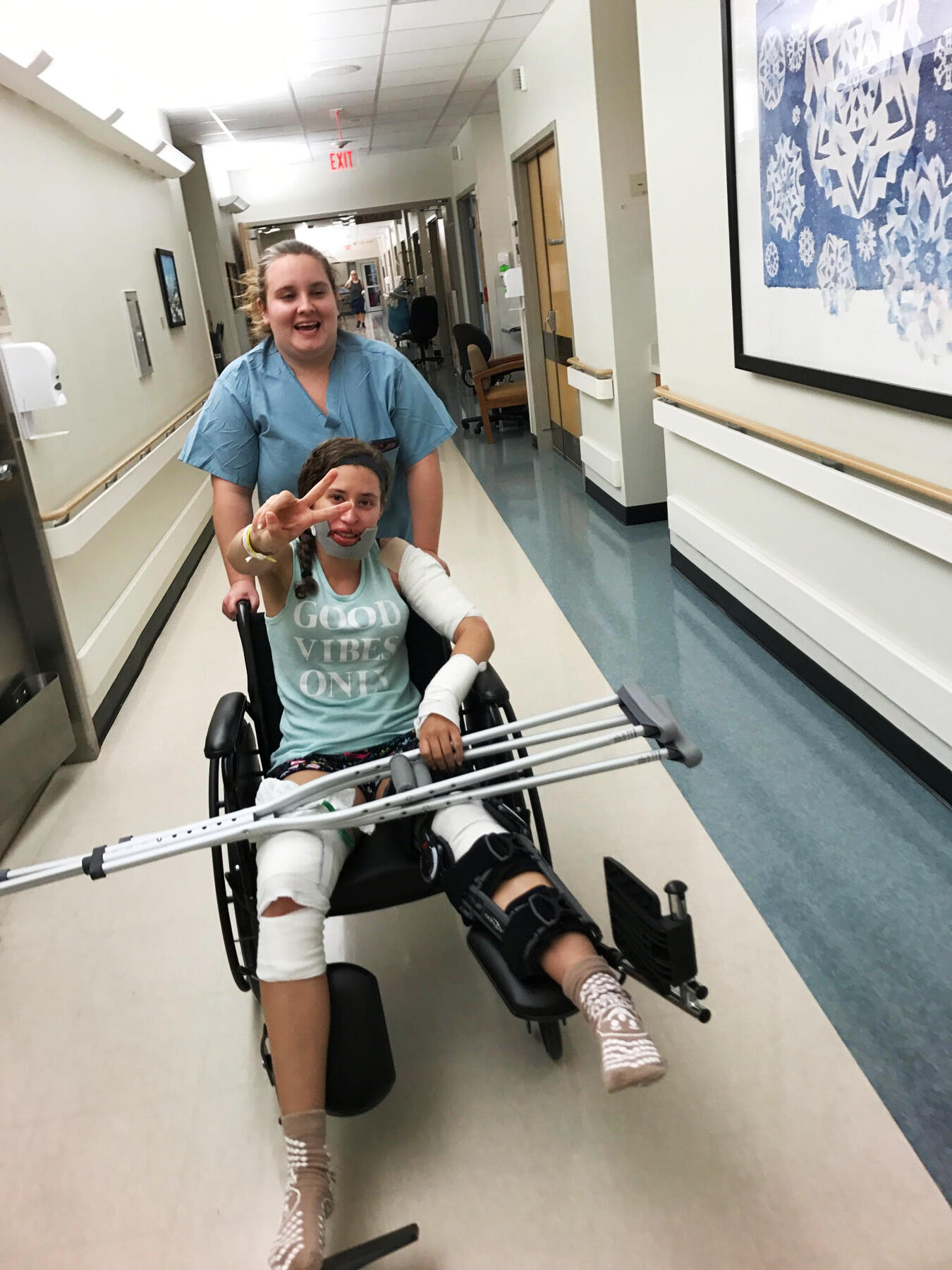 VCU Health care partner Taylor Chavis wheels Malina Richardson out of the hospital April 27.