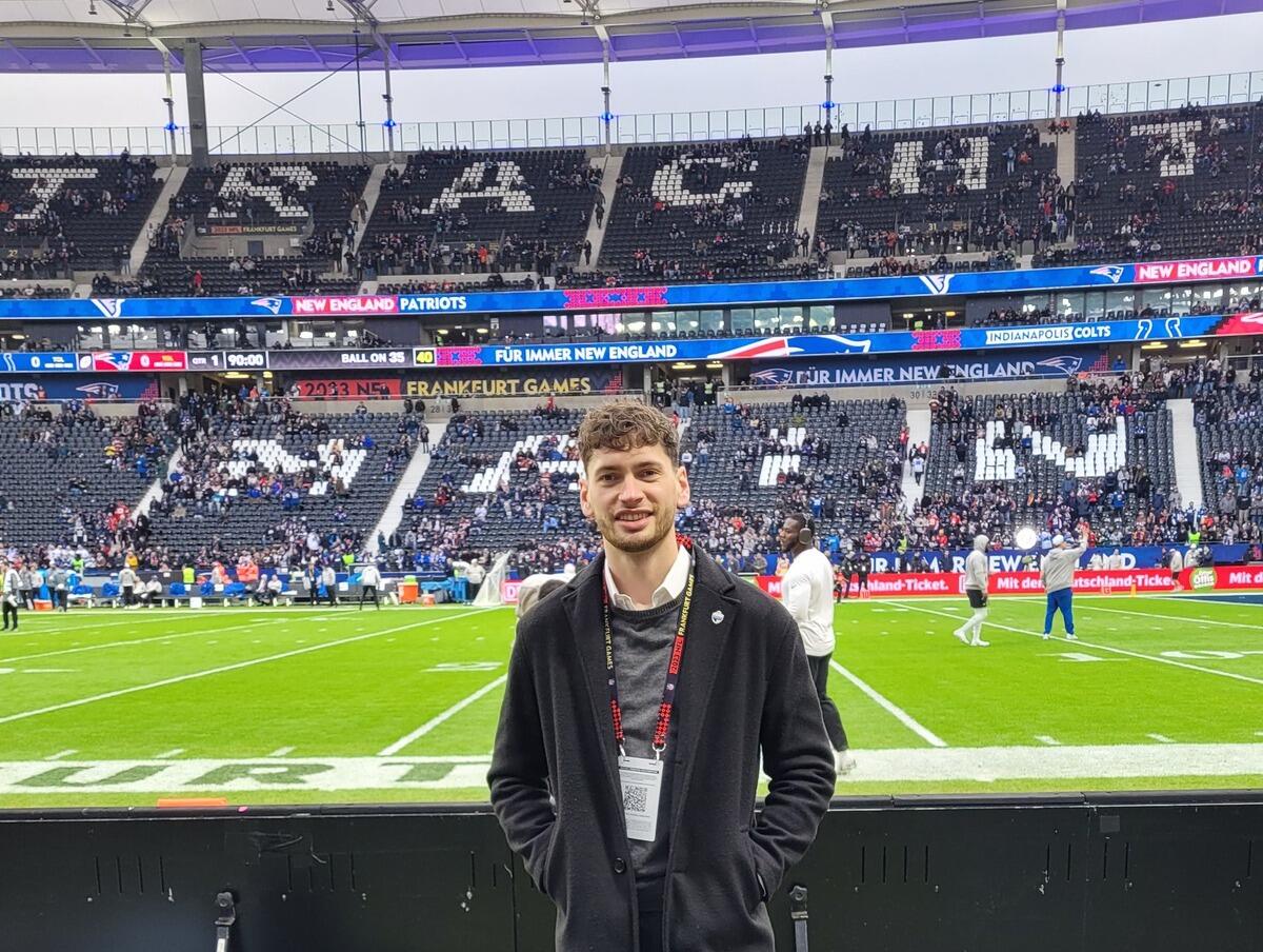 A photo of a man standing in a stadium 