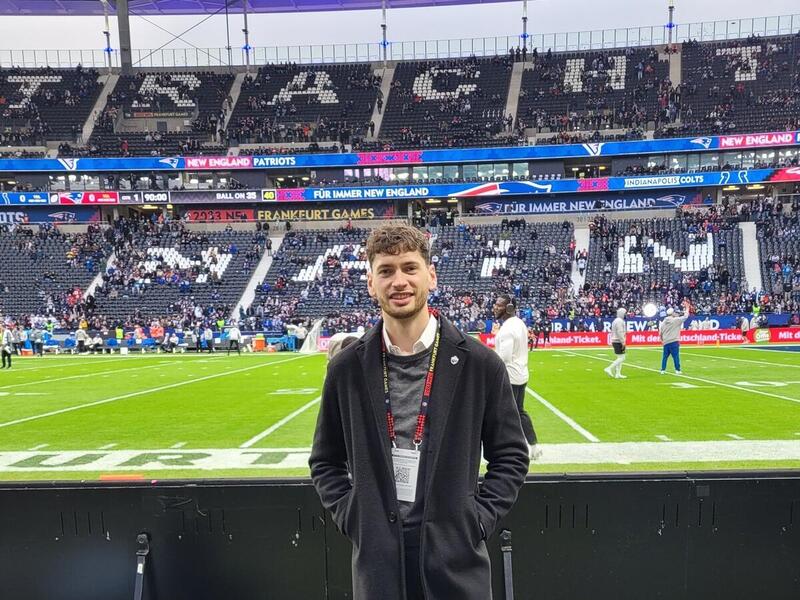 A photo of a man standing in a stadium 