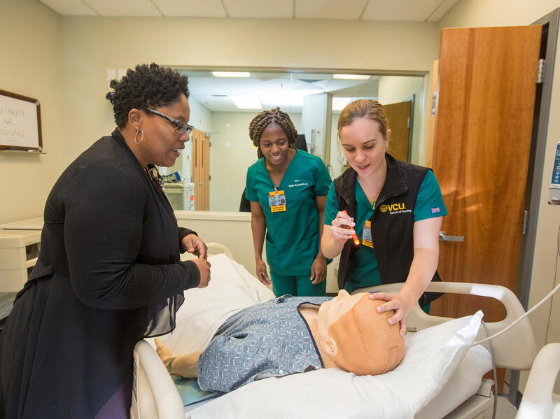 Students work in a simulation lab at VCU School of Nursing.