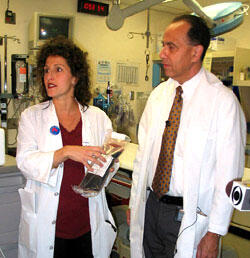 Dr. Therese Duane (left) and Dr. Joe Ornato discuss the blood substitute PolyHeme during a VCU Medical Center press briefing. PolyHeme looks like blood and is designed to carry oxygen to organs and tissues the way blood does.

Photo by Joe Kuttenkuler, University News Services