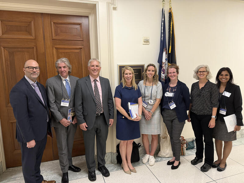A group photo of eight people. 