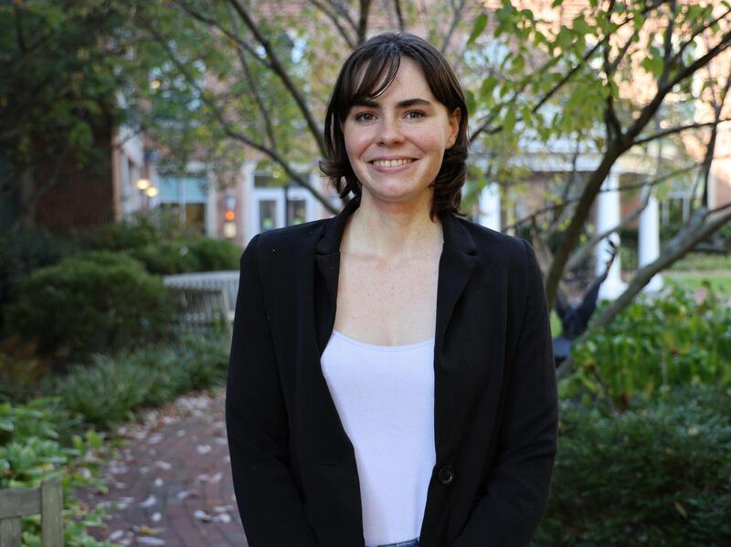 A photo of a woman from the waist up. 