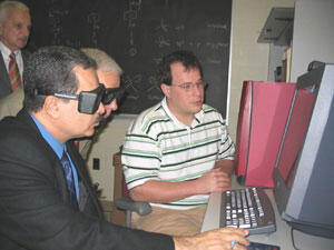 Victor Yanchick (top left) looks on as Mustafa Al-Hiti (left) and Kenneth Miller wear 3-D goggles to view a 3-D drug molecule displayed on a computer and described by VCU postgraduate student Philip Mosier, Ph.D.

Photos by Michael Ford, University News Services
