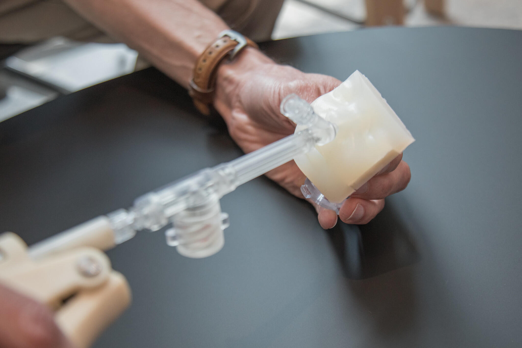 A picture of a clear tube going into a model of a baby's face 