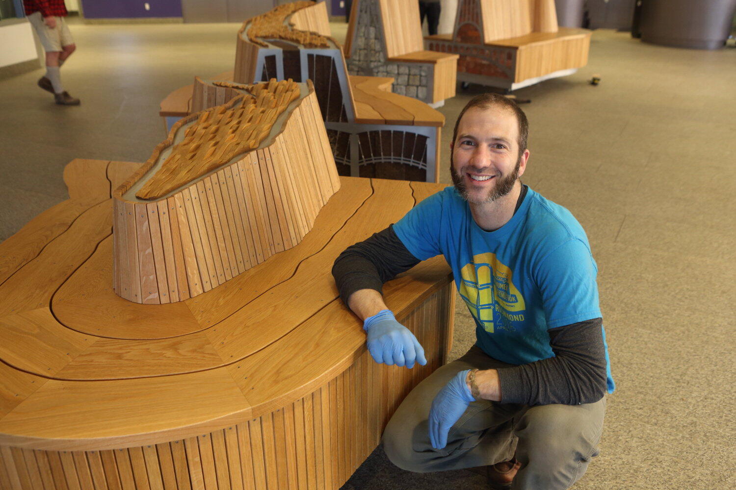 Heath Matysek-Snyder, an assistant professor in the Department of Craft/Material Studies, worked on "Fall Line" for more than two years. It was installed in Cabell Library over spring break. Photo by Jay Paul.