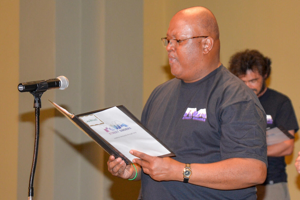 Lawrence Jasper Johnson, a community member who joined the choir because he loves to sing and wants to help people affected by homelessness, performs a solo during a performance of the RVA Street Singers. (Photo by Leila Ugincius, University Public Affairs)